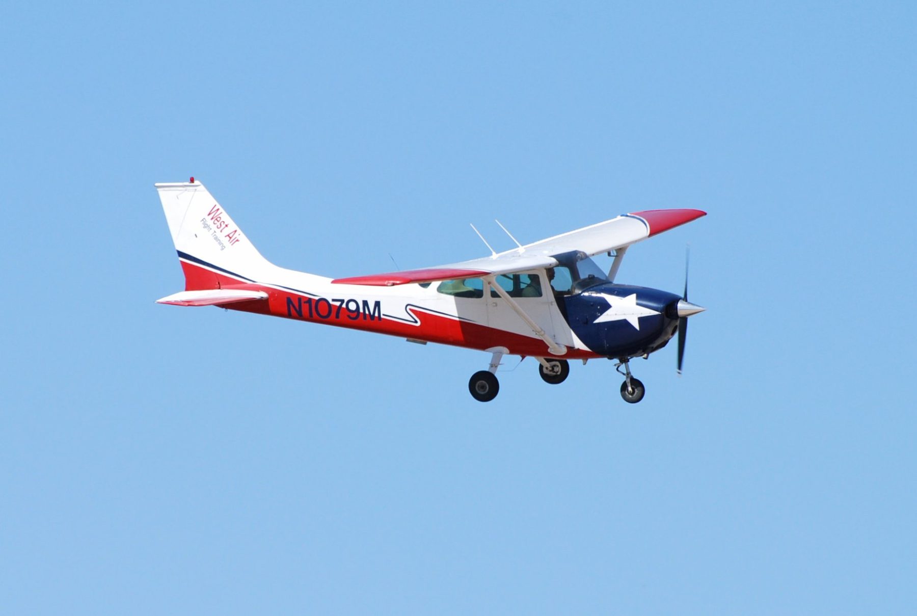 Flight-training aircraft on the ramp at golden hour